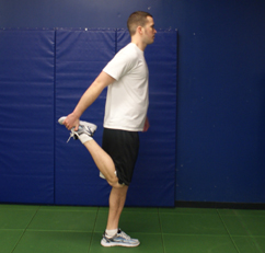 Image of a man stretching his right quadriceps